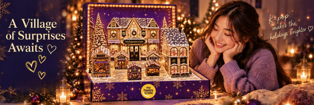 A lit miniature holiday village with the 2026 K-Advent Calendar